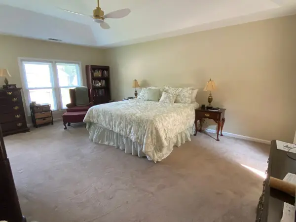 Bedroom with warm neutral walls and white tray ceiling, Bellevue, TN