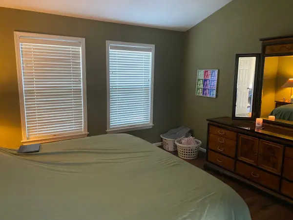 Olive green bedroom with white window trim, Bellevue, TN