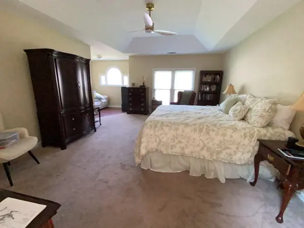 Bedroom with warm neutral walls, white tray ceiling and windows, Bellevue, TN