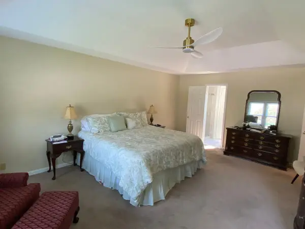 Bedroom with neutral walls and white tray ceiling, wide view, Bellevue, TN