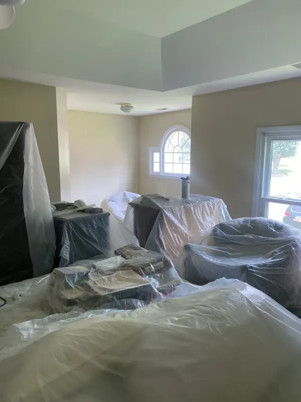 Bedroom furniture gathered and covered in plastic sheeting, Bellevue, TN