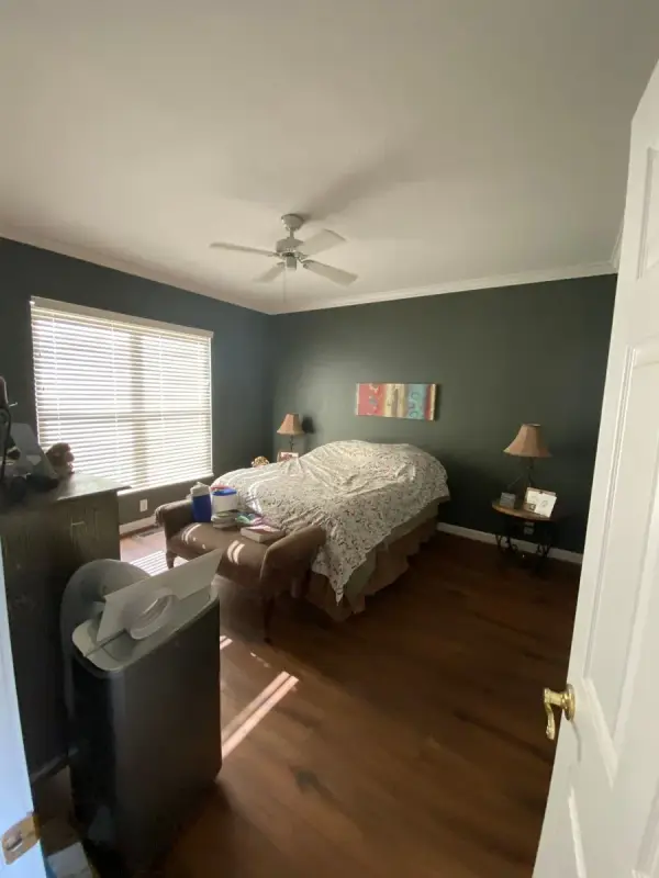 Slate blue bedroom with white crown and window trim, Bellevue, TN