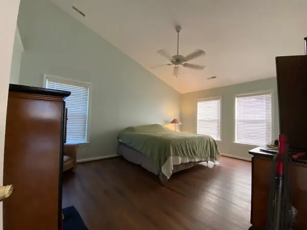 Pale blue-green bedroom with white windows, Bellevue, TN