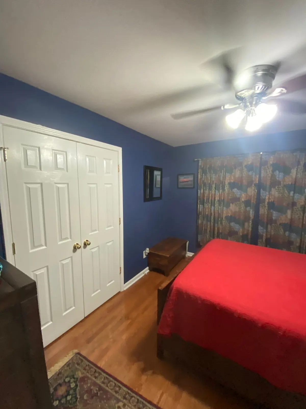 Navy blue bedroom with white double closet doors, Brentwood, TN