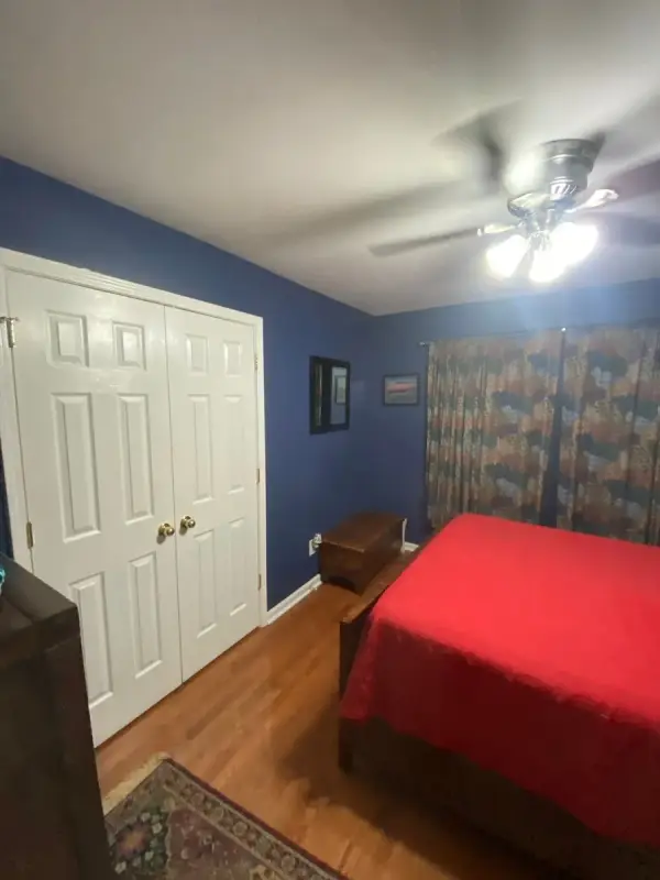 Navy blue bedroom with white double closet doors, Brentwood, TN