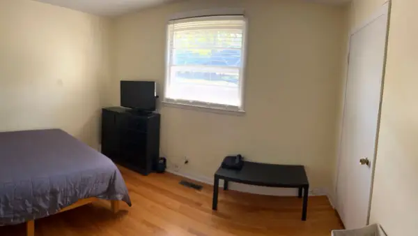 Panorama of a bedroom with pale yellow walls, Brentwood, TN