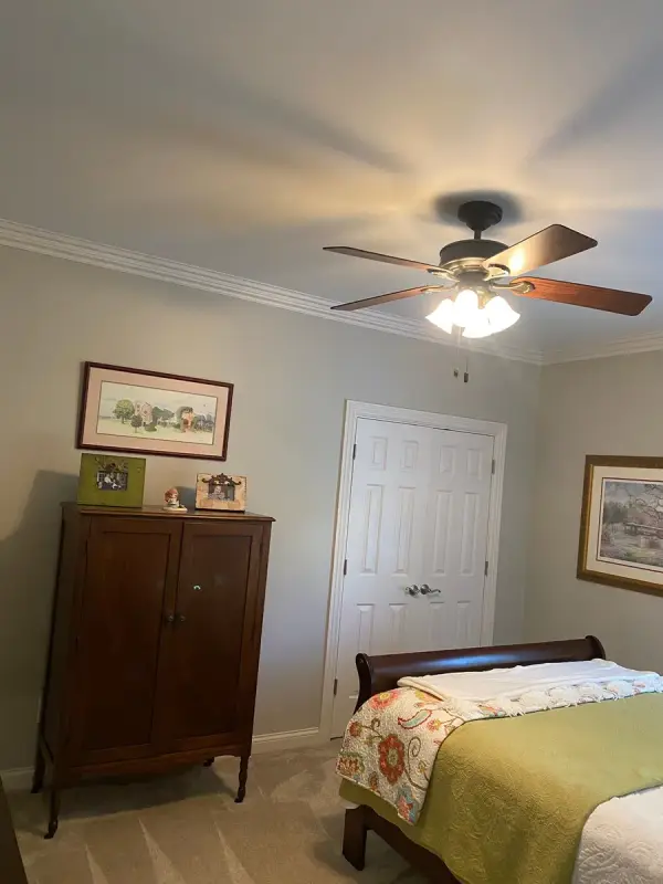 Bedroom with greige walls and white double closet doors, Brentwood, TN