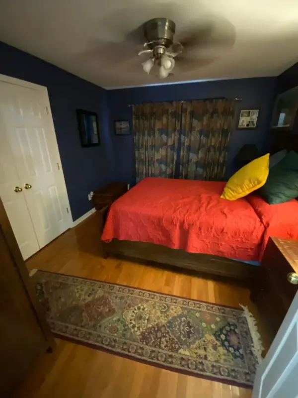 Navy blue bedroom with ceiling fan, Brentwood, TN