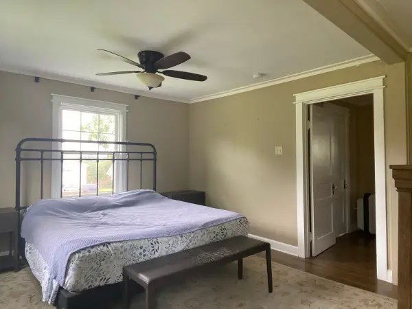 Tan bedroom with white crown molding and white door trim, Fairview, TN