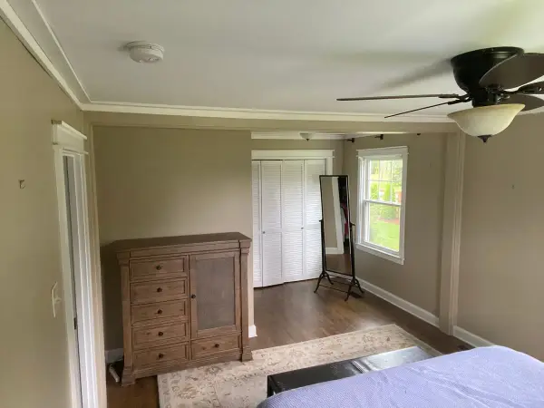 Tan bedroom with white crown molding and closet doors, Fairview, TN