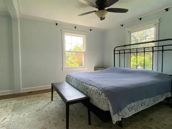 Pale blue-gray bedroom with white crown and window trim, Fairview, TN