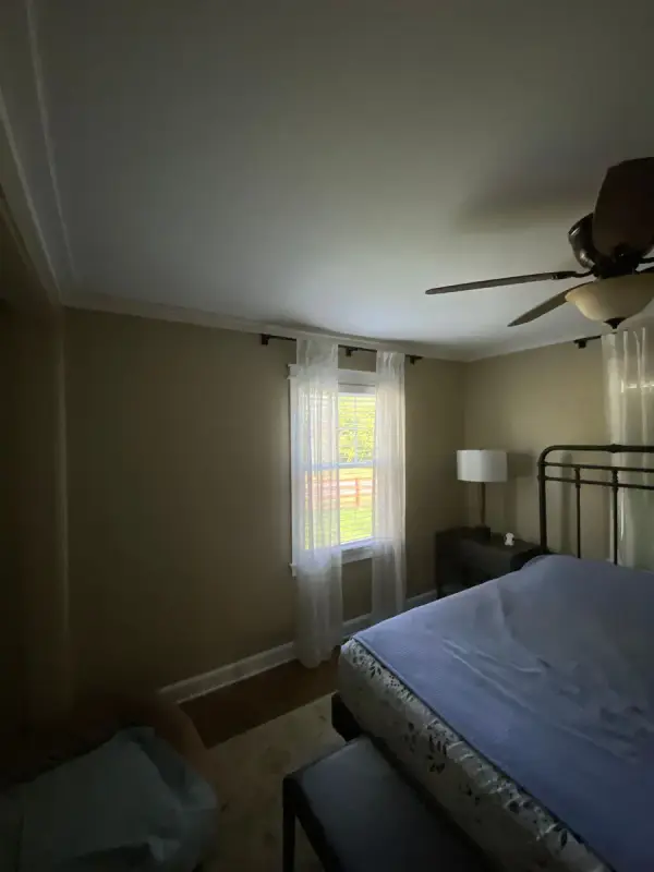 Bedroom with white crown molding in low light, Fairview, TN