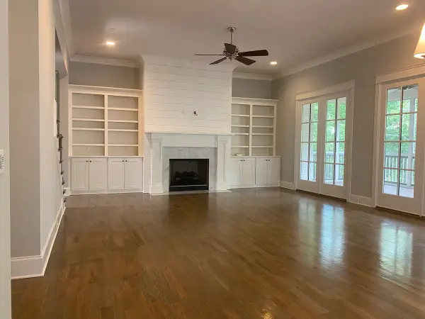 White built-in bookcases flanking a shiplap fireplace wall, Belle Meade, TN