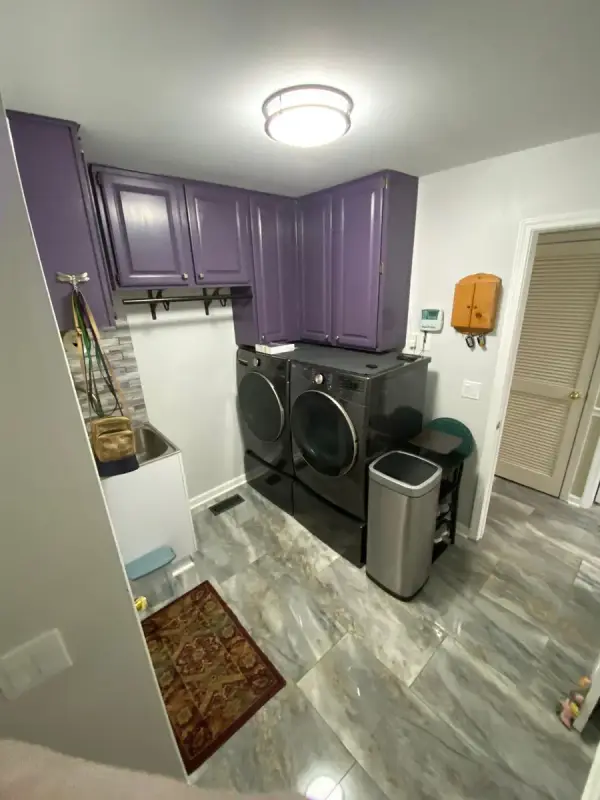 Deep purple laundry cabinets above a washer and dryer, Brentwood, TN