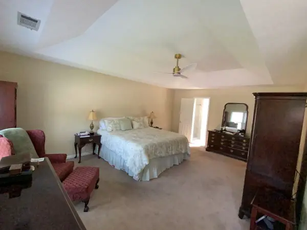 White tray ceiling with fan over a bedroom with neutral walls, Bellevue, TN