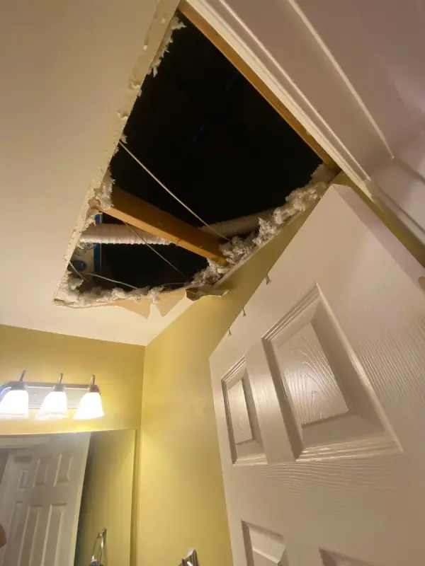 Bathroom ceiling opened to the attic above a door, Bellevue, TN