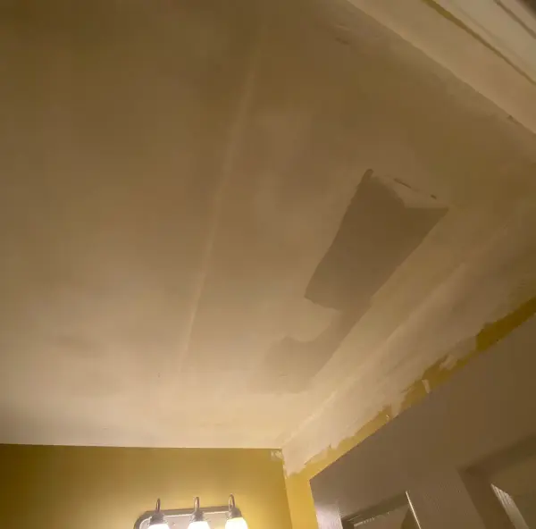 Ceiling patched with compound above a vanity light, Bellevue, TN