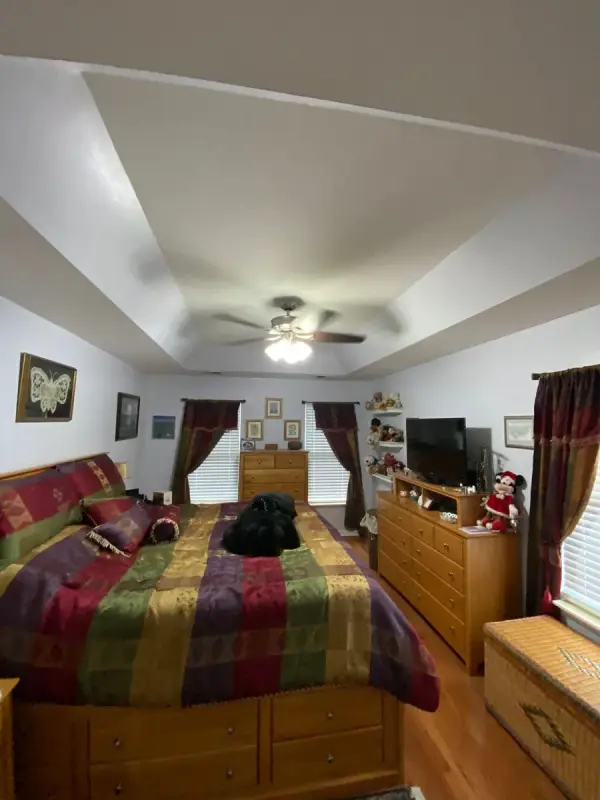 Bedroom with a white tray ceiling and fan, Brentwood, TN