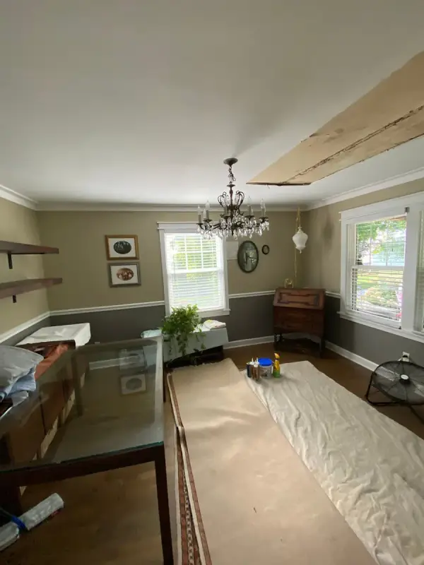 Opened ceiling section over a dining room under drop cloths, Fairview, TN