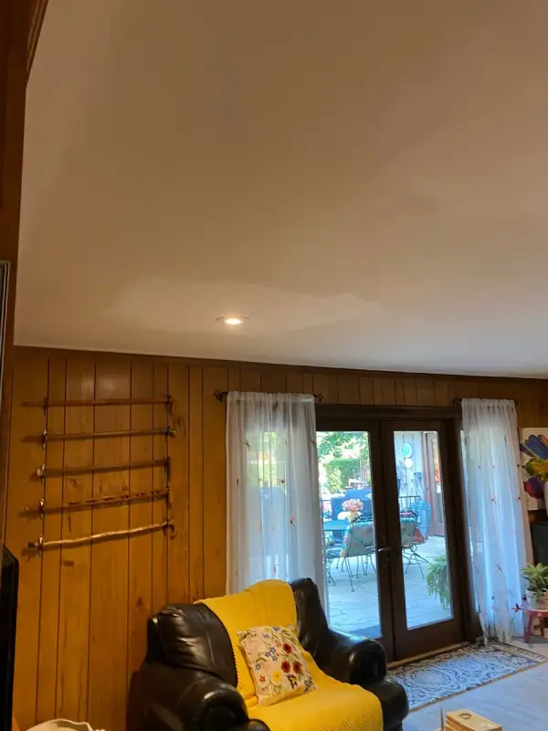 Smooth white ceiling over a knotty-pine paneled wall, Franklin, TN
