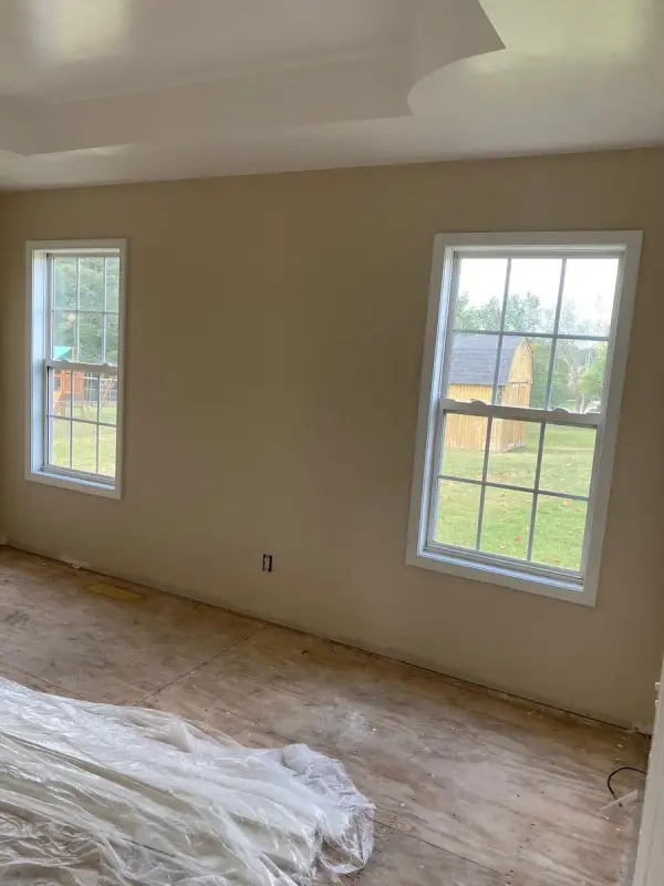 Tray-ceilinged bedroom with cream walls and two windows, Pleasant View, TN