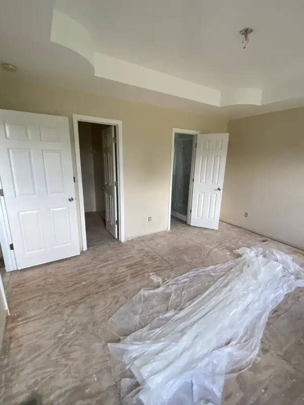 Tray-ceilinged bedroom with white doors and cream walls, Pleasant View, TN