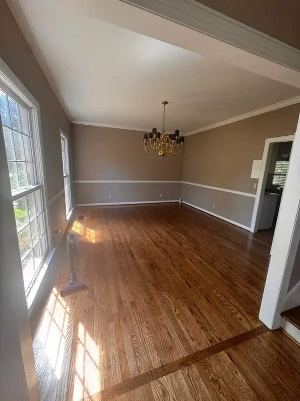 Taupe dining room with white chair rail and crown, Bellevue, TN
