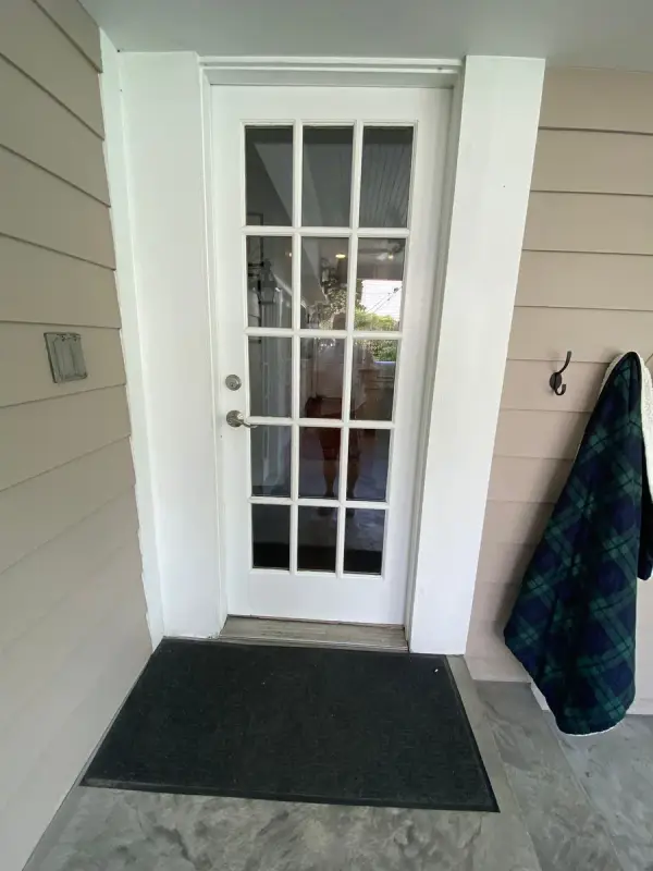 Glass-paneled back door in a white shiplap entry, Belle Meade, TN