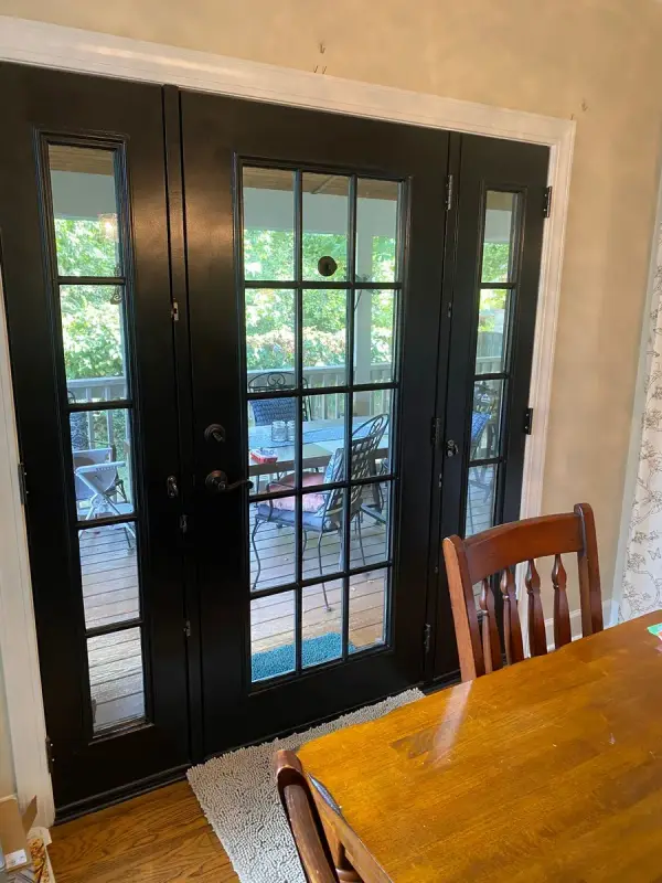 Black French doors and sidelights opening to a screened porch, Bellevue, TN