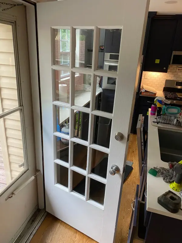 White glass-paneled French door opening to a kitchen, Bellevue, TN