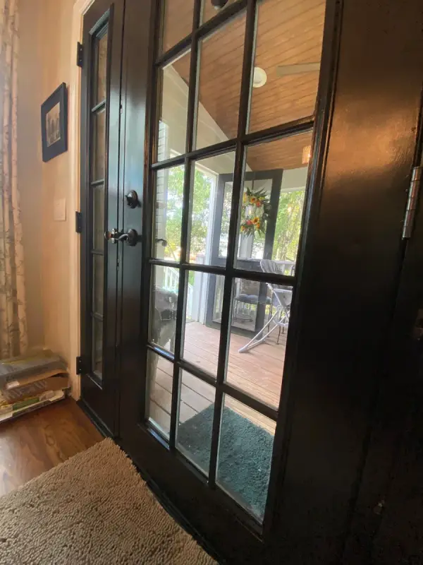 Black French doors from an angle, porch beyond, Bellevue, TN