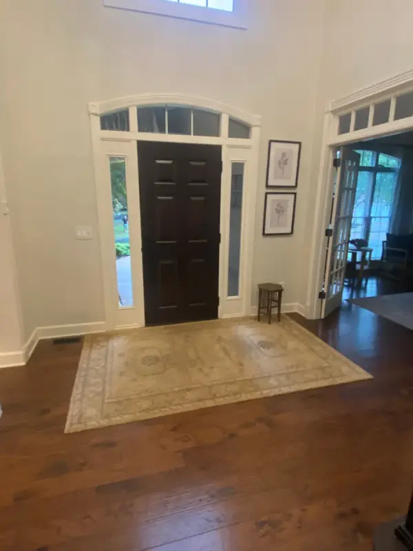Black front door with white sidelight and transom trim, Franklin, TN