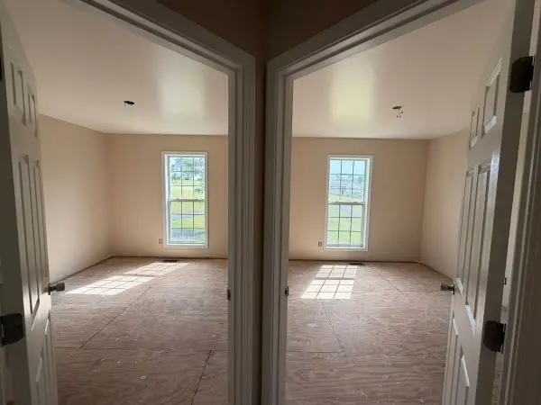 Two cream bedrooms seen through open white doors, Pleasant View, TN