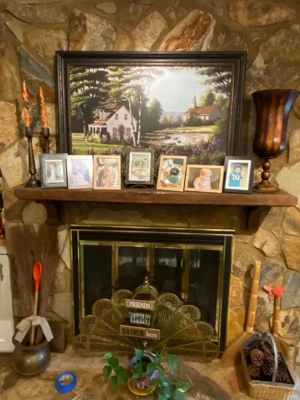 Stone fireplace with a framed painting on the mantel, Franklin, TN