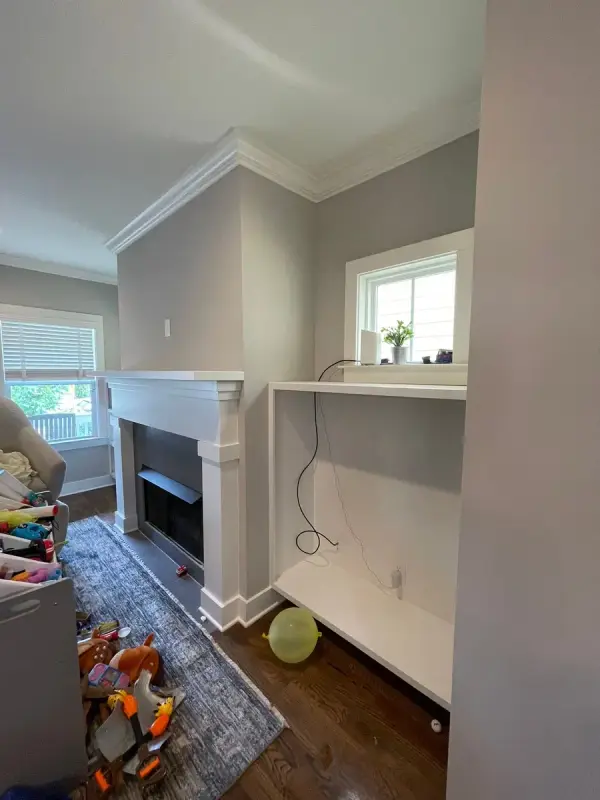 White fireplace mantel and shelf in a gray living room, The Nations, Nashville, TN