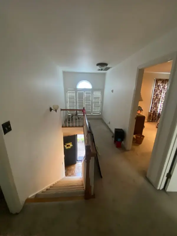 Upstairs hall with white walls above a stairwell, Bellevue, TN
