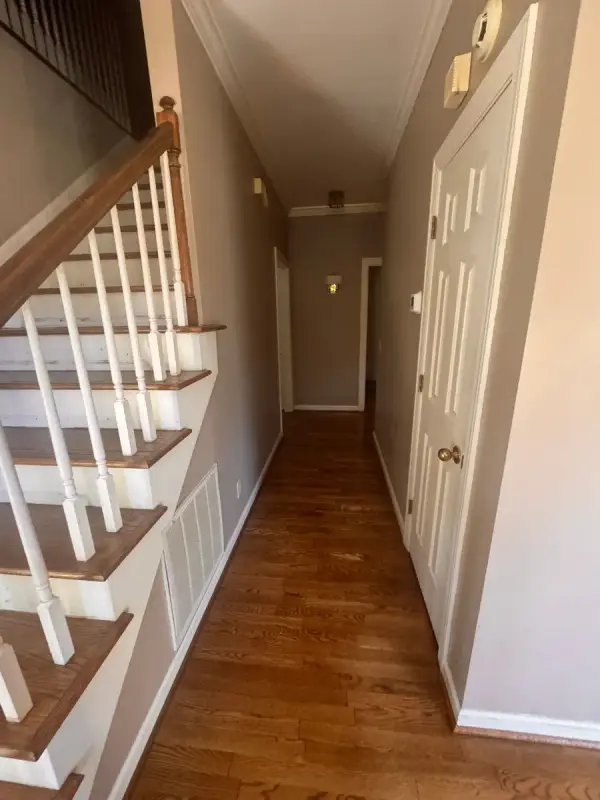 Taupe hall beside a stair with white spindles, Bellevue, TN