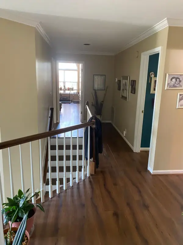 Tan hall with white trim and stair rail, Bellevue, TN