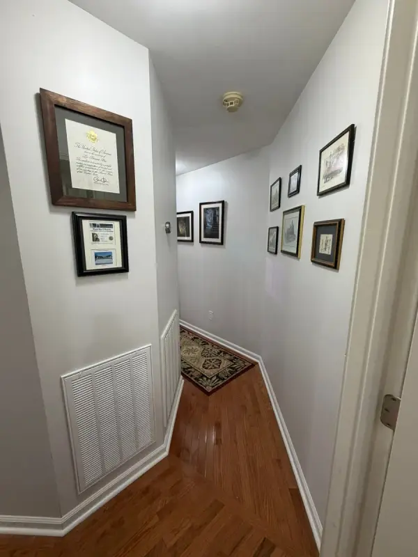 Pale gray hall with white doors and a vent, Brentwood, TN