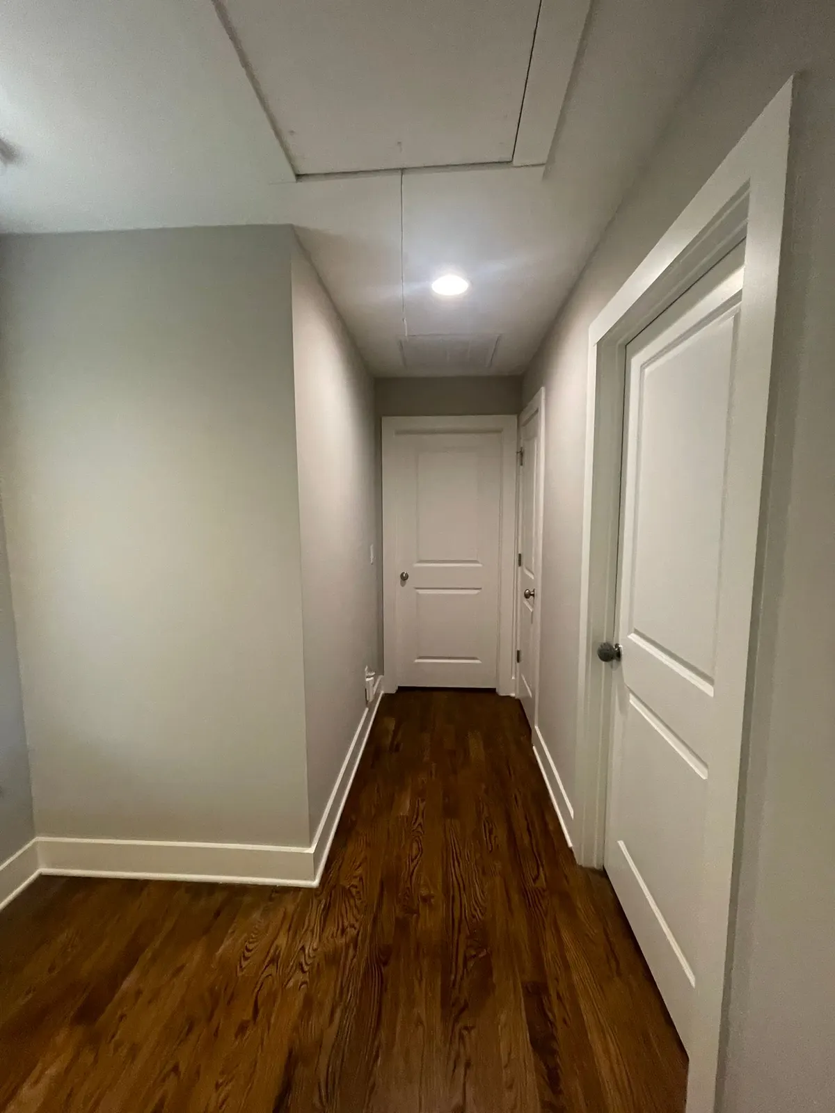 Gray upstairs hallway with white doors and baseboards, The Nations, Nashville, TN