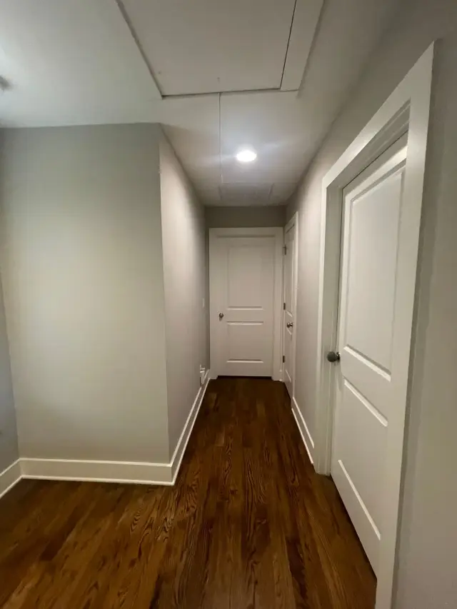 Gray upstairs hallway with white doors and baseboards, The Nations, Nashville, TN