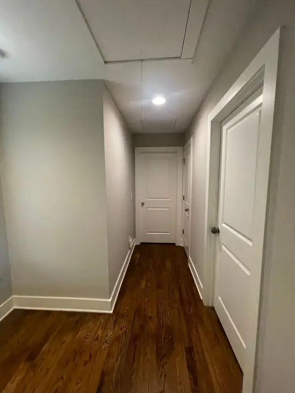 Gray upstairs hallway with white doors and baseboards, The Nations, Nashville, TN