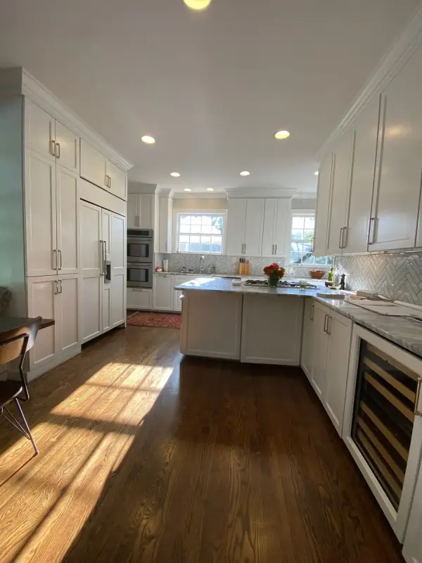 White kitchen with sunlit oak floors and a beverage fridge, Belle Meade, TN