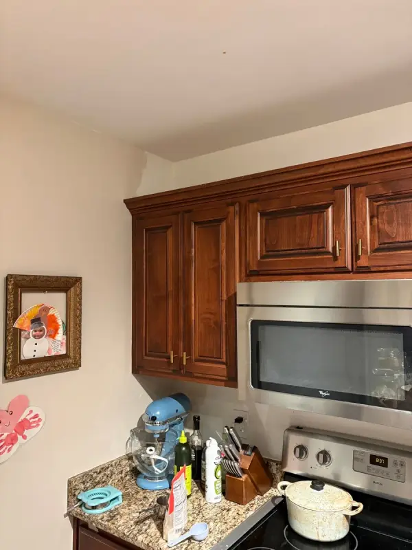 Kitchen corner with wood cabinets and white walls, Belle Meade, TN