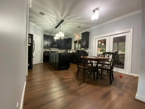 Breakfast area with gray walls beside black kitchen cabinets, Bellevue, TN