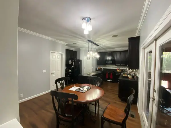 Gray-walled breakfast area by black cabinets, Bellevue, TN