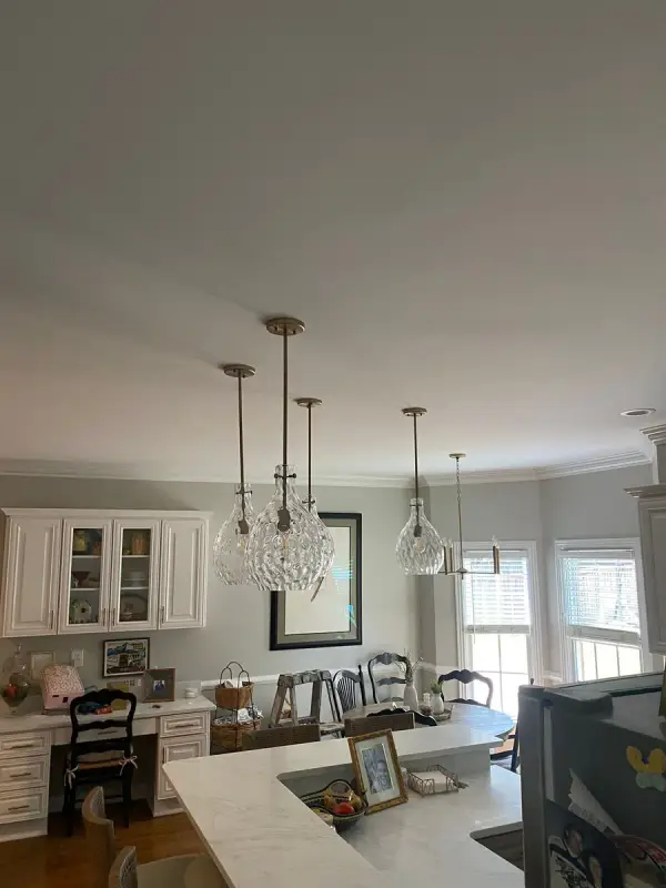 Kitchen and breakfast area with greige walls and pendants, Brentwood, TN