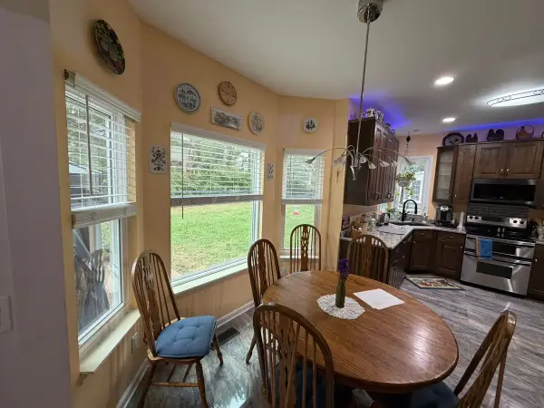 Butter-yellow breakfast area with white window trim, Brentwood, TN