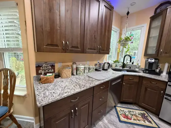 Kitchen with butter-yellow walls over wood cabinets, Brentwood, TN