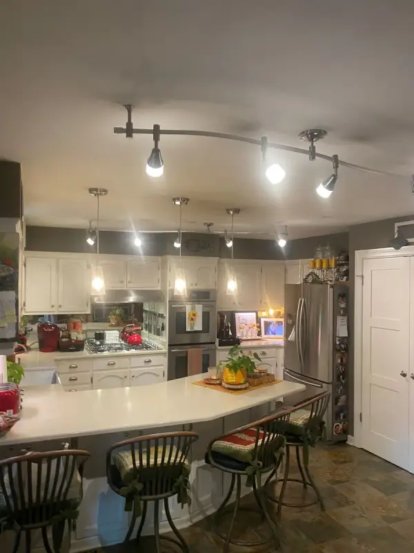 Kitchen with gray walls, white cabinets and track lighting, Franklin, TN